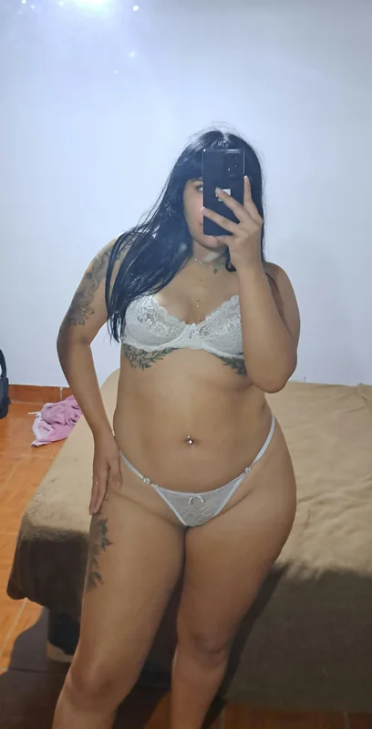 Martina OnlyFans creator with tattoos and piercings.